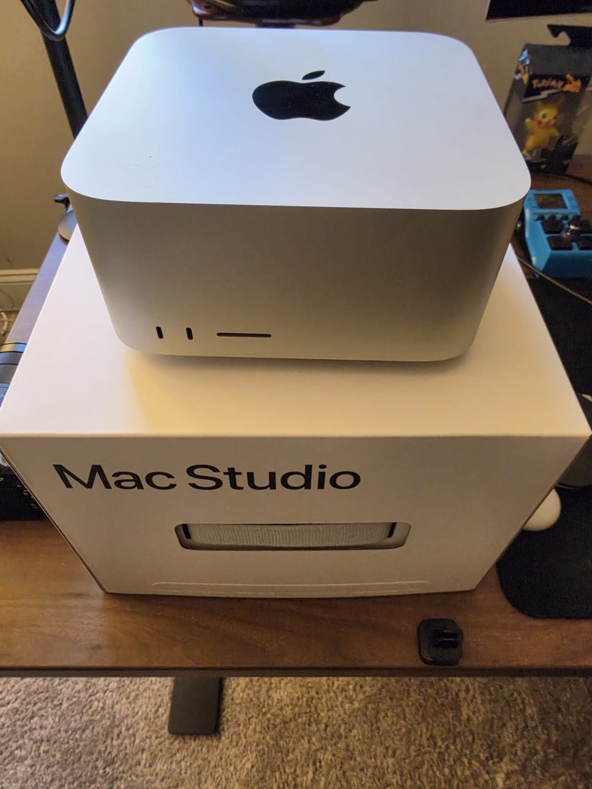 Apple Mac Studio sitting on its retail box